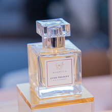 Load image into Gallery viewer, Perfume bottle labeled 'Ever Present' by 'Marbella' on a blurred background